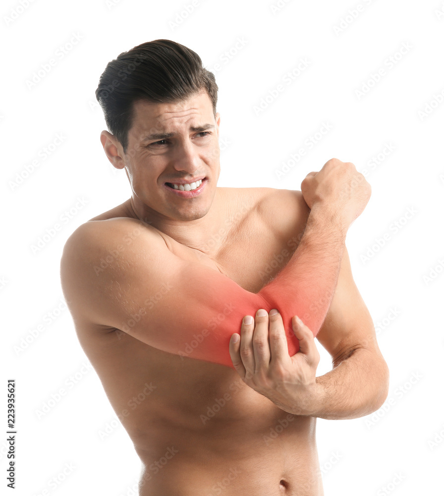 Young man suffering from pain in elbow on white background Young man suffering from pain in elbow on white background
