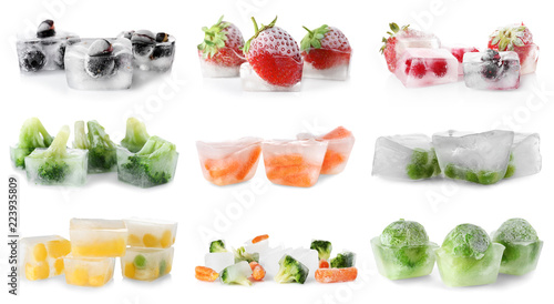 Set with vegetables and berries frozen in ice cubes on white background