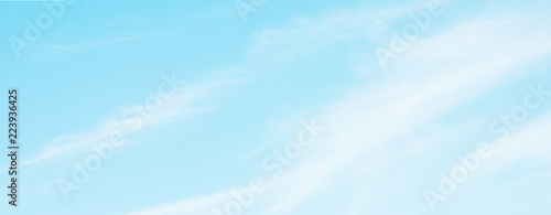 Panoramic Blue sky background with soft white clouds
