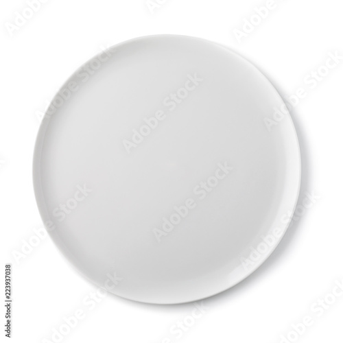 Empty ceramic plate of white color, top view of an isolated object