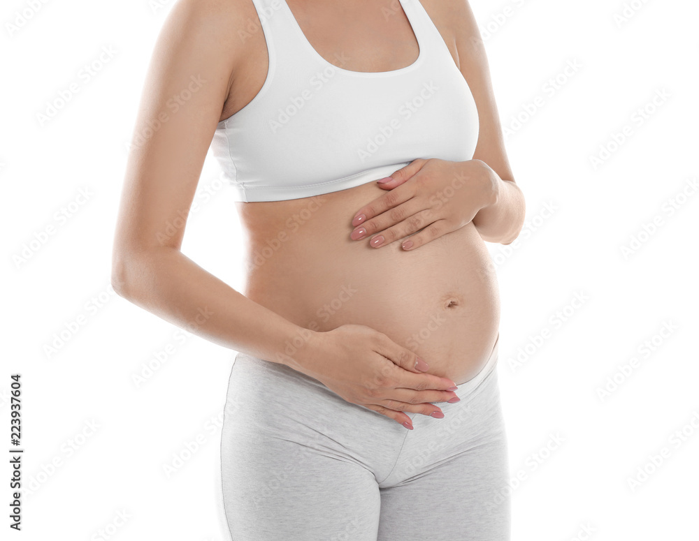 Beautiful pregnant woman holding belly on white background, closeup Beautiful pregnant woman holding belly on white background, closeup