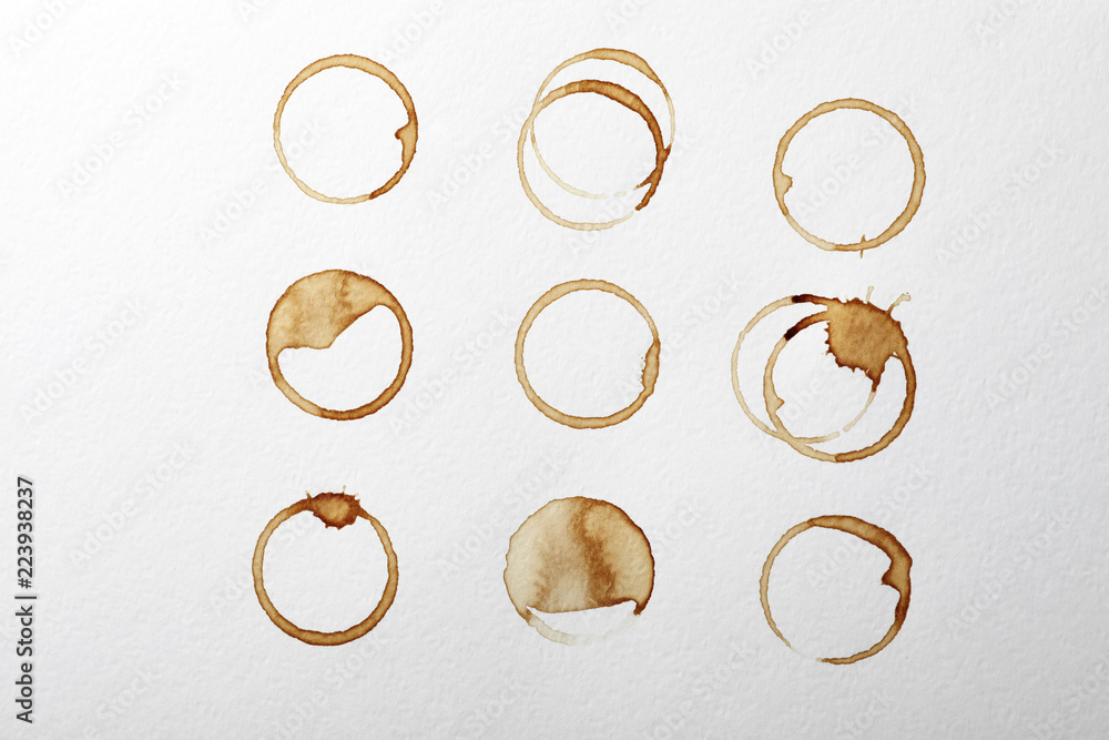 Dried coffee cup stains on white background, top view Dried coffee cup stains on white background, top view