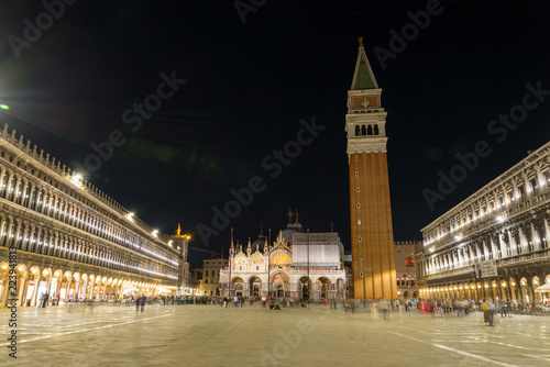 Night scenery of Piazza San Marco, St. Mark's Square, the square surrounded by shop, restaurant, Saint Mark's Basilica and St Mark's Campanile in Venice, Italy. © Peeradontax