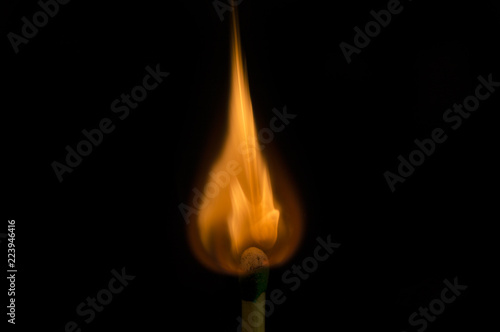 Teardrop shaped flame on tip of match being lit © Stretch Clendennen