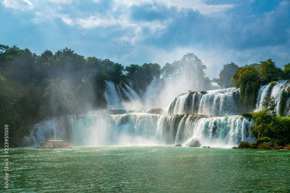 Bangioc - Detian waterfall is locate at border of China and Vietnam, It's famous water fall of both country. There are boat service tourist for see nearby the waterfall. Bangioc - Detian waterfall is locate at border of China and Vietnam, It's famous water fall of both country. There are boat service tourist for see nearby the waterfall.