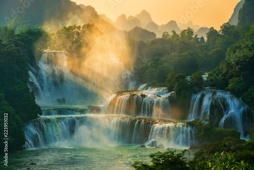 Fototapeta Naklejka Na Ścianę i Meble -  Bangioc - Detian waterfall is locate at border of China and Vietnam, It's famous water fall of both country. There are boat service tourist for see nearby the waterfall.