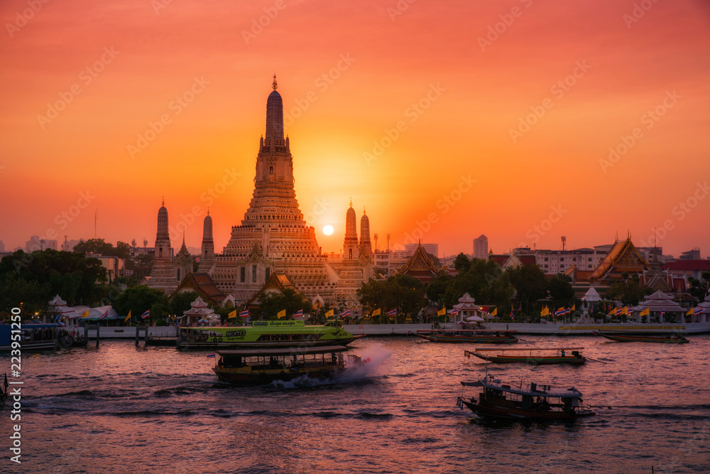 Sunset at Arun Temple or Wat Arun, locate at along the Chao Phraya river with a colorful sky in Bangkok, Thailand