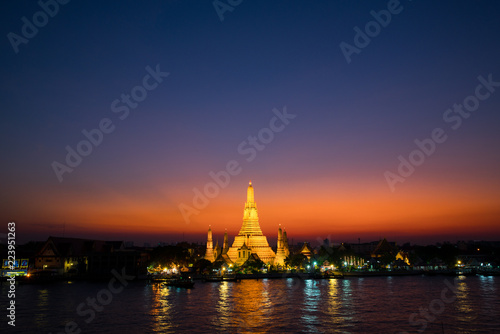 Sunset at Arun Temple or Wat Arun, locate at along the Chao Phraya river with a colorful sky in Bangkok, Thailand