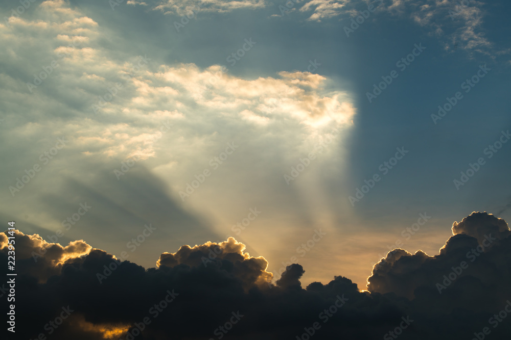 Sun rays through clouds like an dramatic explosion , power nature background.