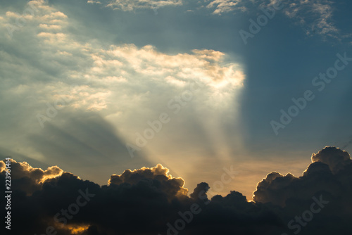 Sun rays through clouds like an dramatic explosion , power nature background.