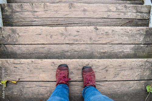 Red shoes on wooden stairs