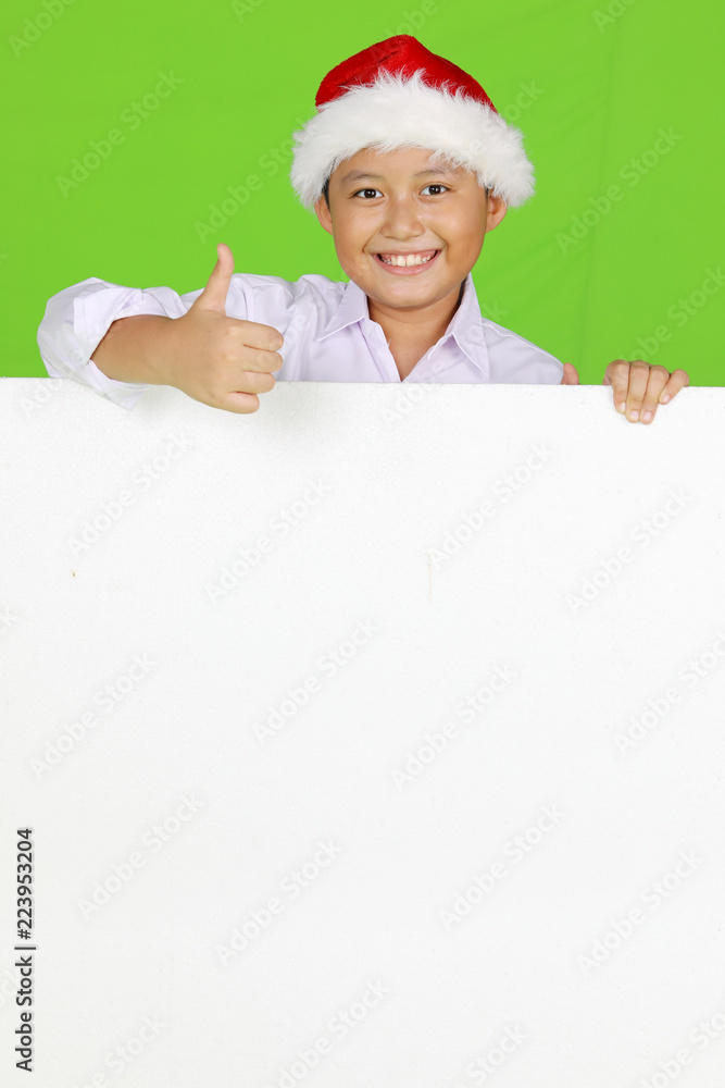 Preteen boy showing a blank whiteboard Preteen boy showing a blank whiteboard