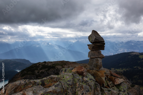 Stack of Rocks on top of a mountain during a cloudy summer day. Taken from top of Panorama Ridge, located near Whister and Squamish, North of Vancouver, BC, Canada. © edb3_16