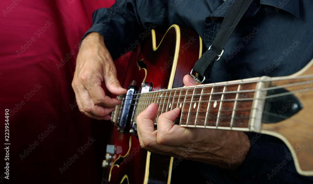 Guitarist hands and guitar close up. playing electric guitar.  - obrazy, fototapety, plakaty 