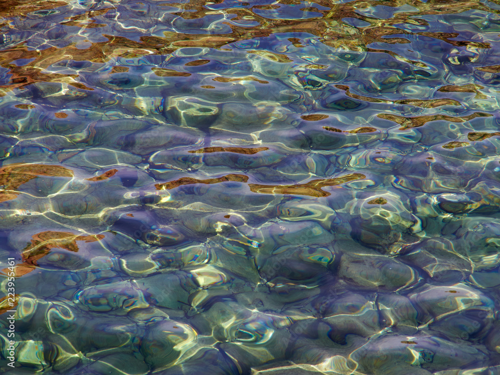 Clear blue sea ocean water over rocks Clear blue sea ocean water over rocks