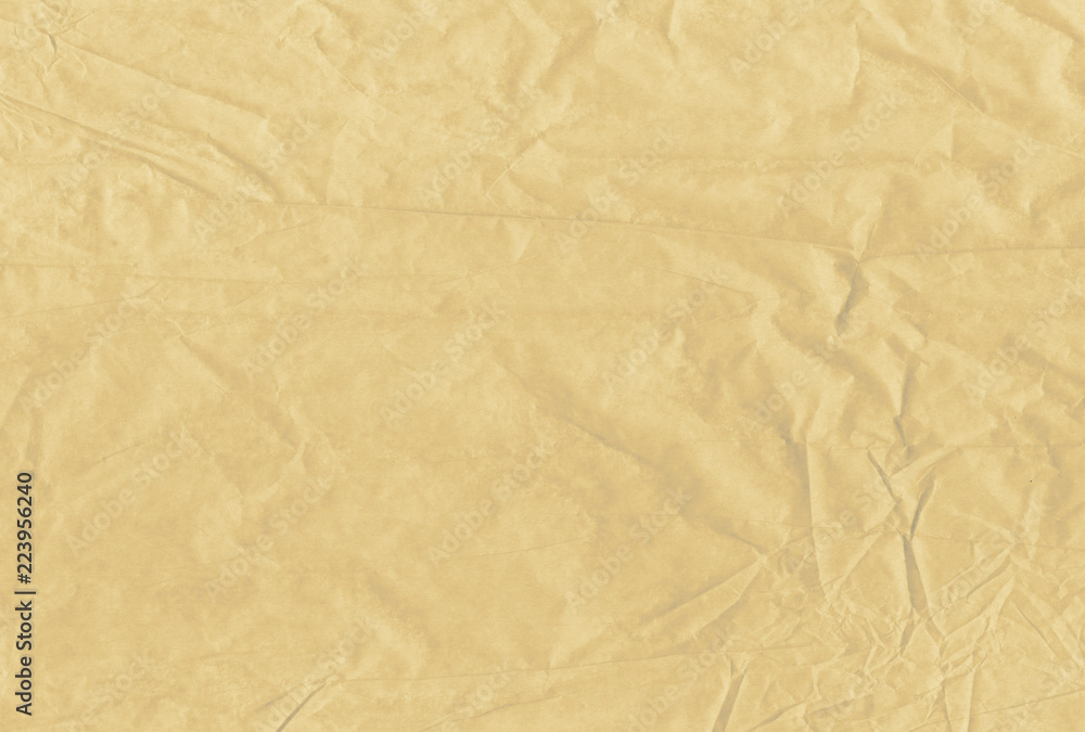 Light brown blank crumpled and grungy textured paper background Light brown blank crumpled and grungy textured paper background