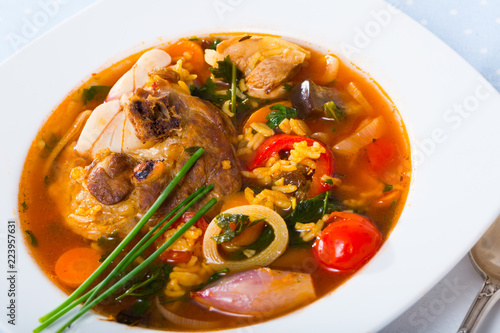 Lamb's soup cooked with rice, vegetables, onion and garlic