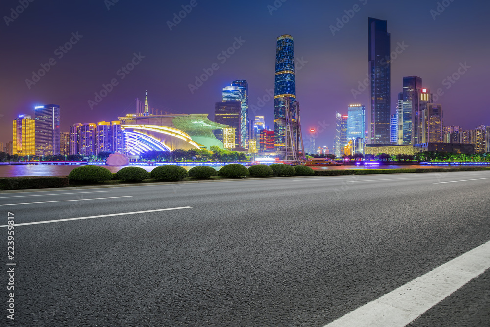 Naklejka premium Road pavement and Guangzhou city buildings skyline