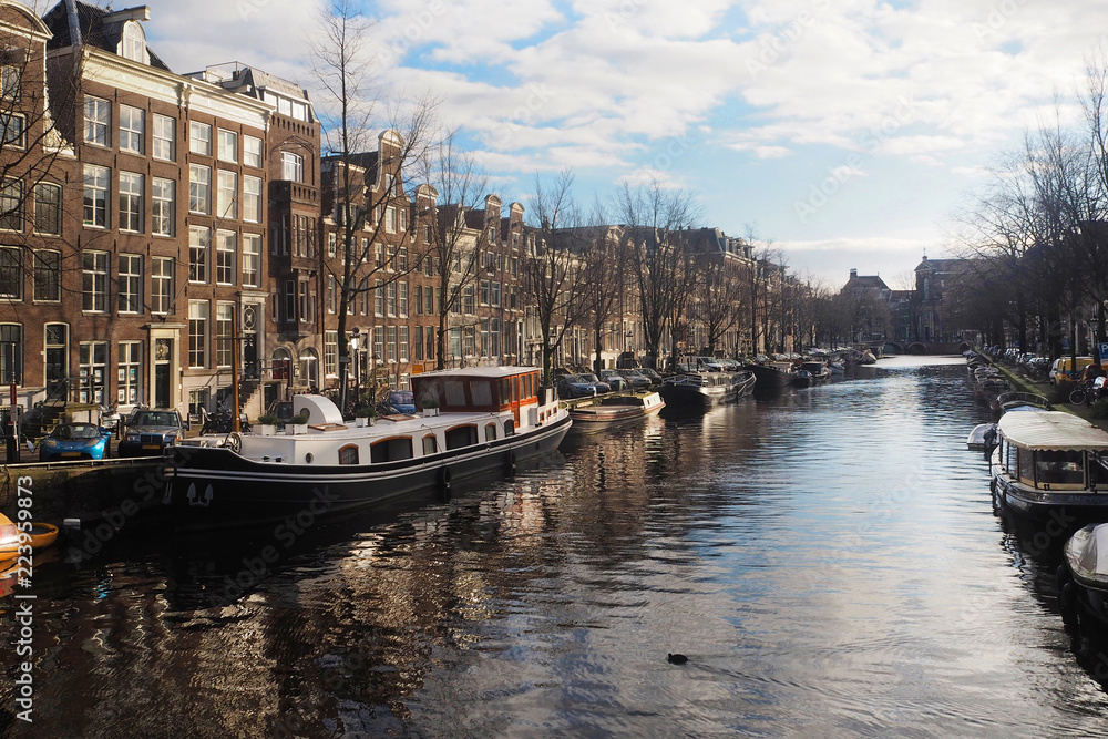 Canals and boats of Amsterdam in winter