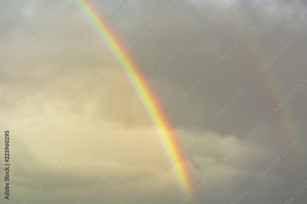 Bright rainbow against the sky after the rain Bright rainbow against the sky after the rain
