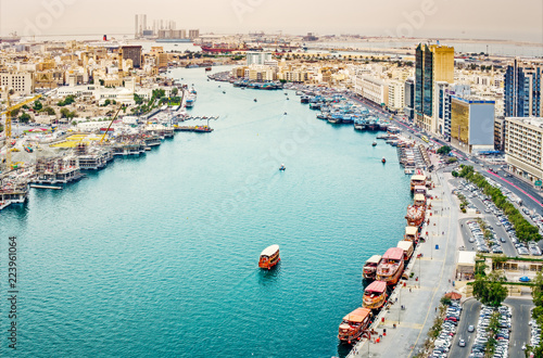 Aerial daytime skyline of Dubai, UAE. View on harbor in the distance. Scenic travel background.