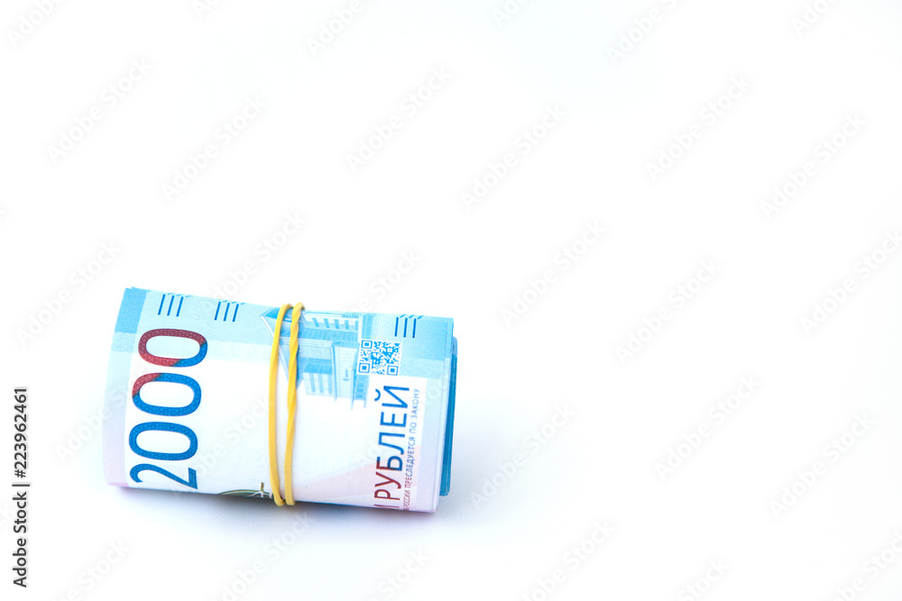 Russian money banknotes currency rouble on white isolated background. in nominal value of two thousand. Close up. Rich concept