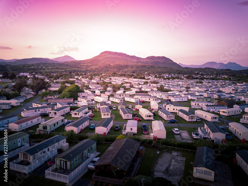 Sun set at a Caravan and camping park, static home aerial view. Porthmadog holiday park taken from the air by a drone