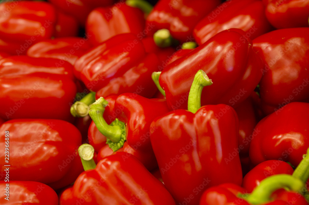 FRESH RED PEPPERS ON SUPERMARKET SHELF IN CLOSE UP