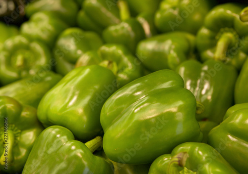 FRESH GREEN PEPPERS ON SUPERMARKET SHELF IN CLOSE UP