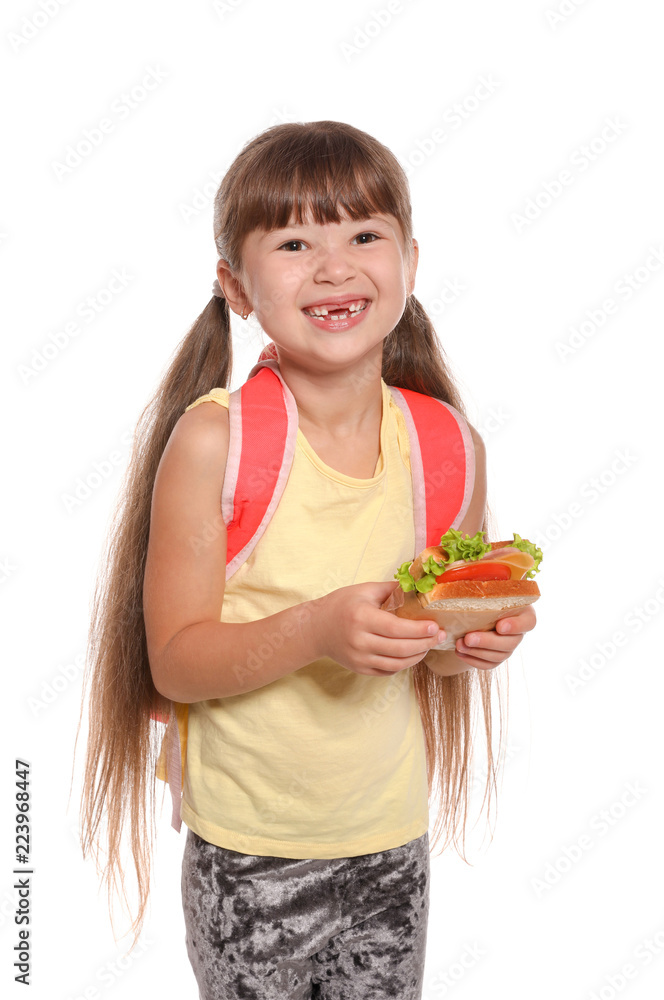 Schoolgirl with healthy food and backpack on white background Schoolgirl with healthy food and backpack on white background
