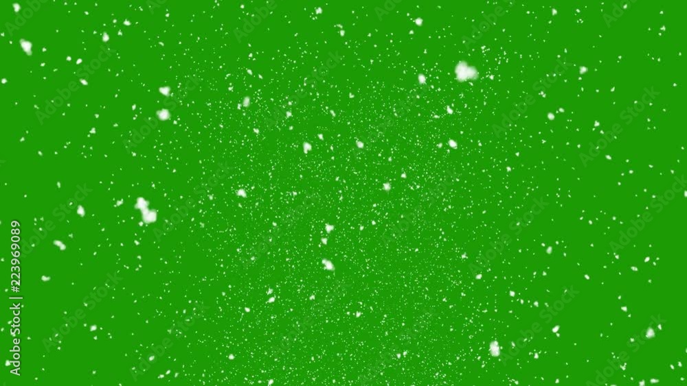 Isolated falling snow on green screen