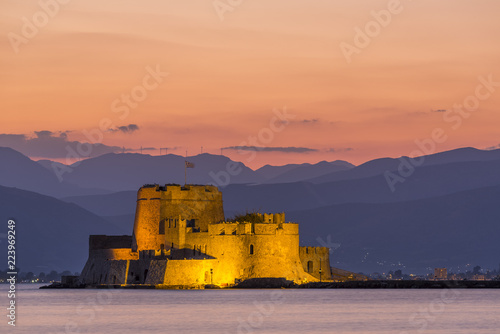 Evening view of Bourtzi fortress with mountains in the background in Nafplio photo