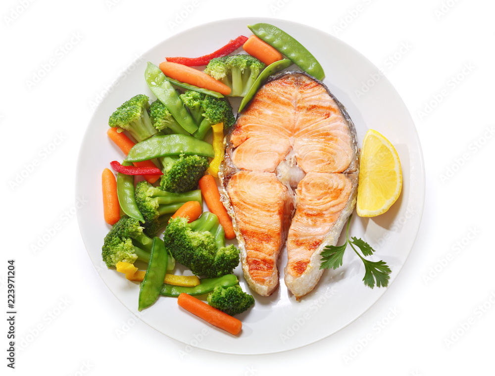 plate of grilled salmon steak isolated on white background plate of grilled salmon steak isolated on white background