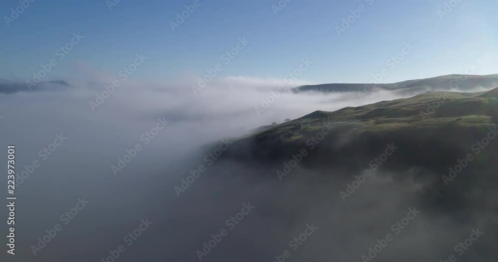 Flying above clouds and mountains in north England. Flying above clouds and mountains in north England.