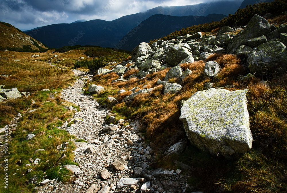 stone walkway into the valley in the mountains stone walkway into the valley in the mountains