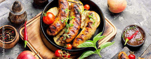 Grilled sausages in frying pan photo