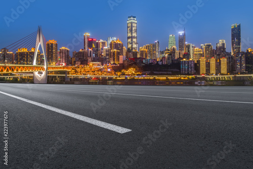 Road pavement and Chongqing urban architecture skyline © 昊 周