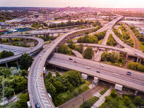Cuadro en lienzo Aerial view of a complex motorway road junction with traffic moving