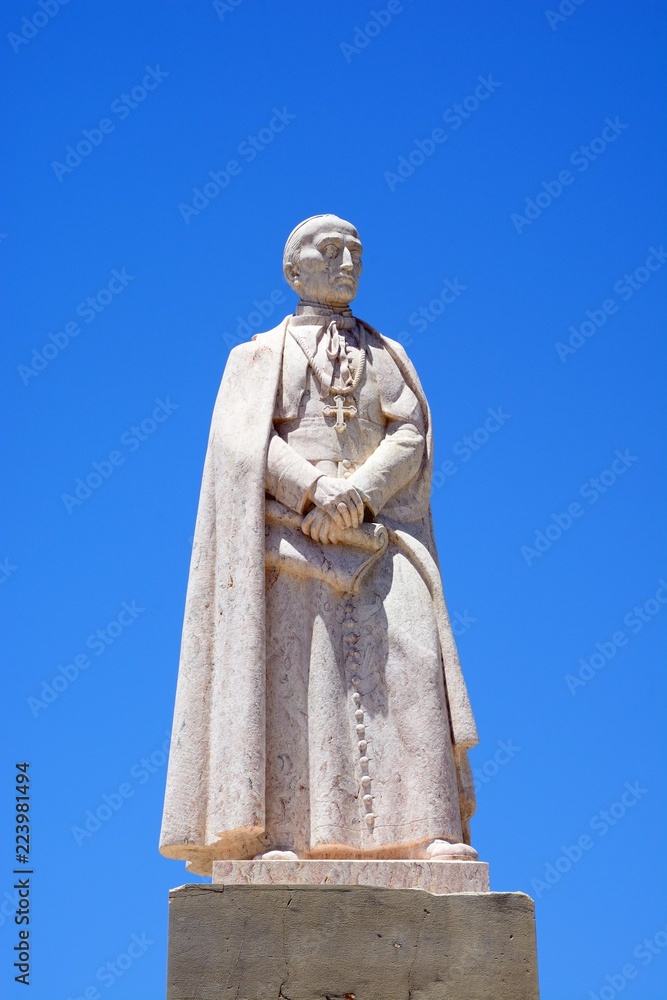 Obraz premium Bishop Francisco Gomes Do Avelar statue in the Praca Largo de Se in the city centre, Faro, Algarve, Portugal.