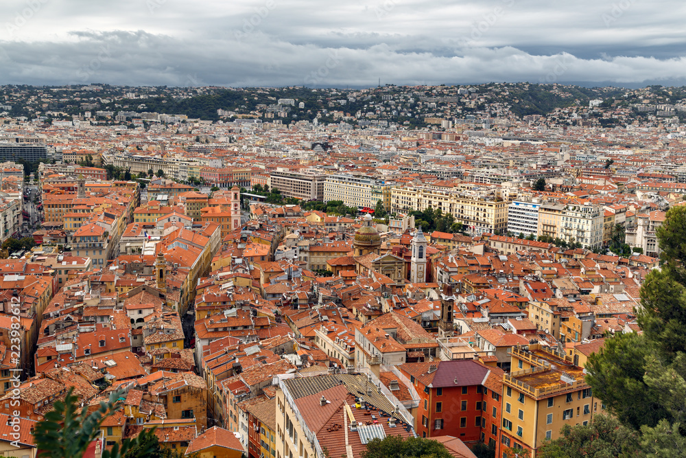 Nice old town, French Riviera, France. View of the city with red roofs, colorful houses and narrow streets from above. Travel Europe.