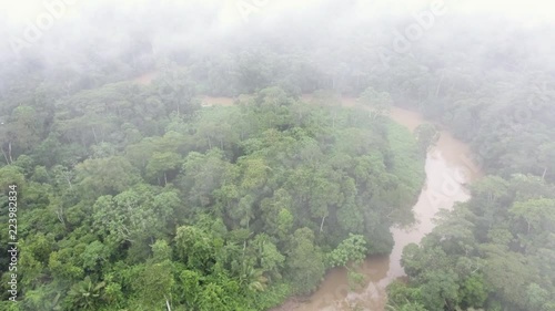 Aerial time-lapse of the canopy of pristine tropical rainforest at dawn through the mist on a bend of Rio Shiripuno in the Ecuadorian Amazon.  photo