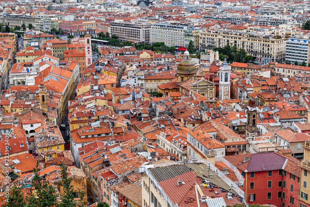 Obraz premium Nice old town, French Riviera, France. View of the city with red roofs, colorful houses and narrow streets from above. Travel Europe.