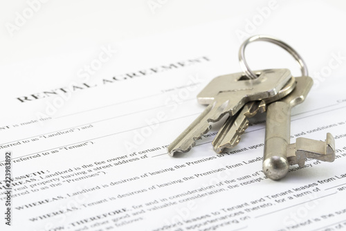 rental agreement document with a set of house keys