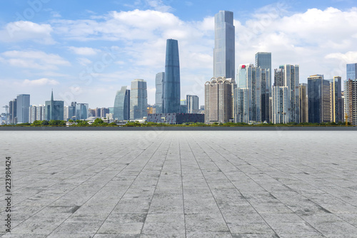 Urban skyscrapers with empty square floor tiles