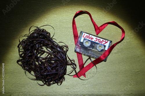 Fotografie Confused relationships.Broken heart and love.Cartridge tape