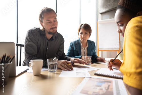 Architect and interior designers talking about new ideas of a project in conference room.