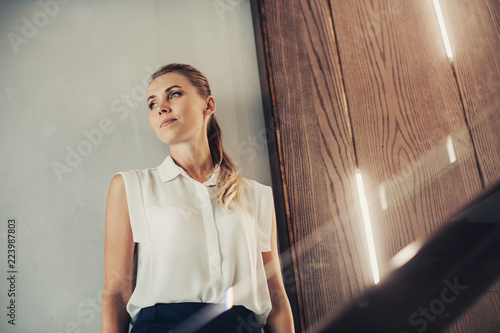 Konstfotografi Portrait of orderly female dreaming while locating indoor