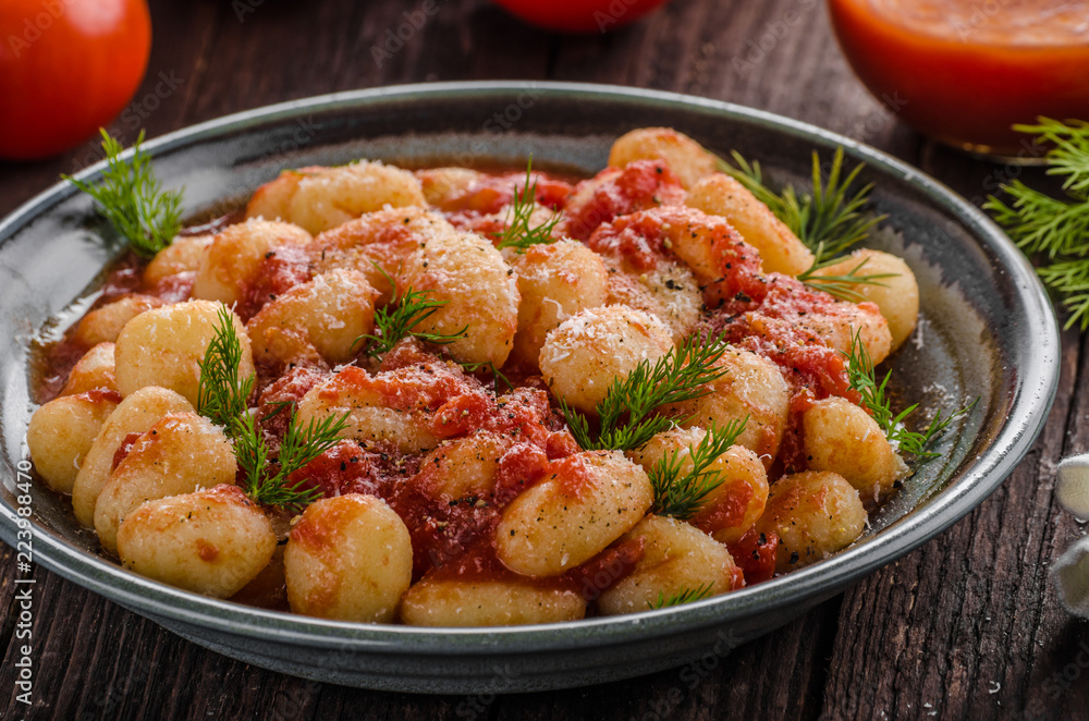 Fototapeta premium Gnocchi tomato sauce herbs