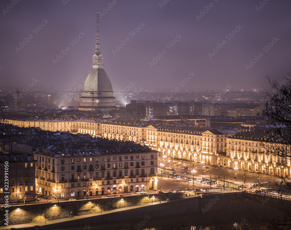 Naklejka premium Piazza Vittorio Veneto in Turin, Italy, at night with Mole Antonelliana in the back