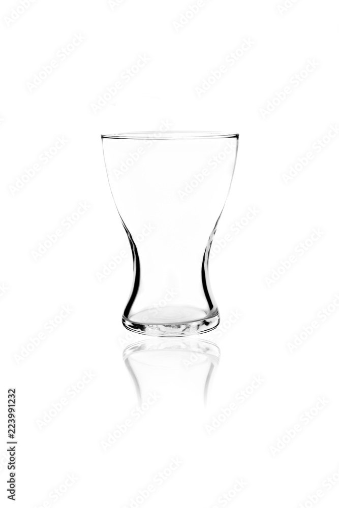 Empty simple glass and its reflection isolated on white background Empty simple glass and its reflection isolated on white background